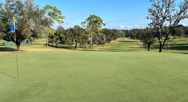 A sunny day view of a hole at Mount Dora Golf Club.