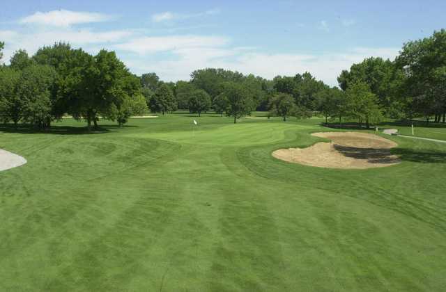 A view of a green with bunkers on the right at Joe Louis Golf Club