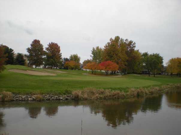 A view of green #17 surrounded by water at The Rail Golf Club