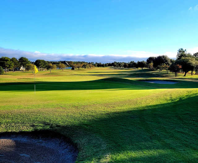 A sunny day view of a hole at Green Acres Golf & Recreation Club.