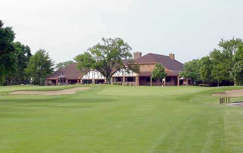 A view of the 9th green and clubhouse in background at Bonnie Brook Golf Course