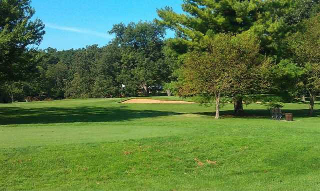 A view of a green with a bunker on the right at Bonnie Brook Golf Course