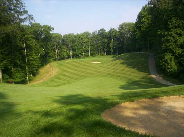 A view of a green with a narrow path on the right at Legendary Run Golf Club