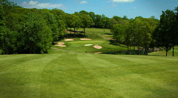 A view of a green surrounded by bunkers at Laurel View Country Club