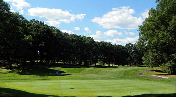A view of a green and a fairway at Keney Park Golf Club