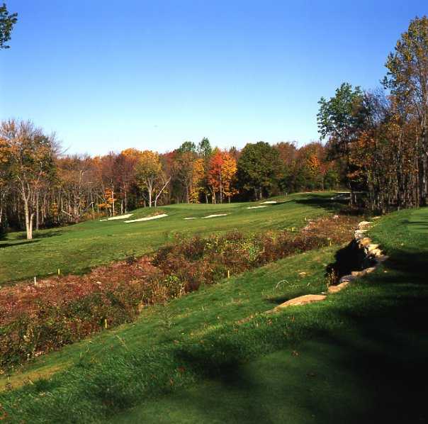 A view of green #16 protected by bunkers at Oxford Greens Golf Club