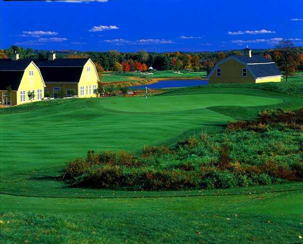 A view of a green and the clubhouse at Ranch Golf Club