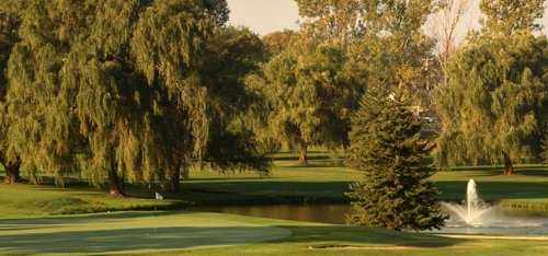 A view of a green with water coming into play from right at Red/Blue from Fox Creek Golf Course at Par 5 Resort.