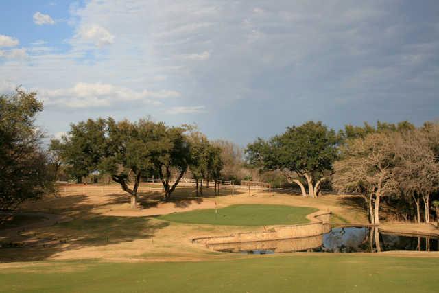 The par-4 16th hole at Ram Rock plays downhill to a small green guarded by water on the right side. 
