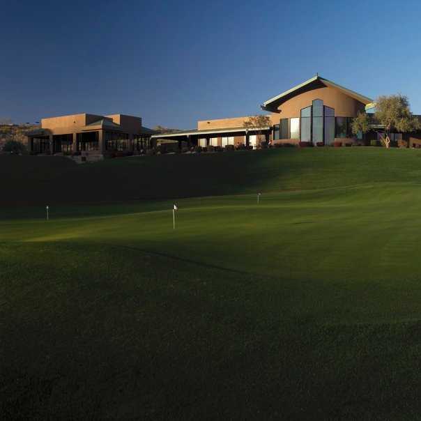 A view of the clubhouse and putting green at Eagle Mountain Golf Club