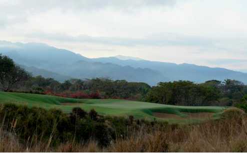 A view of a green protected by bunkers at Nicklaus Course from Vista Vallarta Golf Club