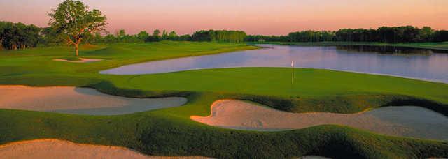 A view of a green with water coming into play at Black Hawk Country Club