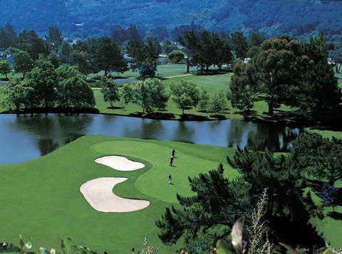 A view of a green protected by bunkers at Quail Lodge Resort & Golf Club