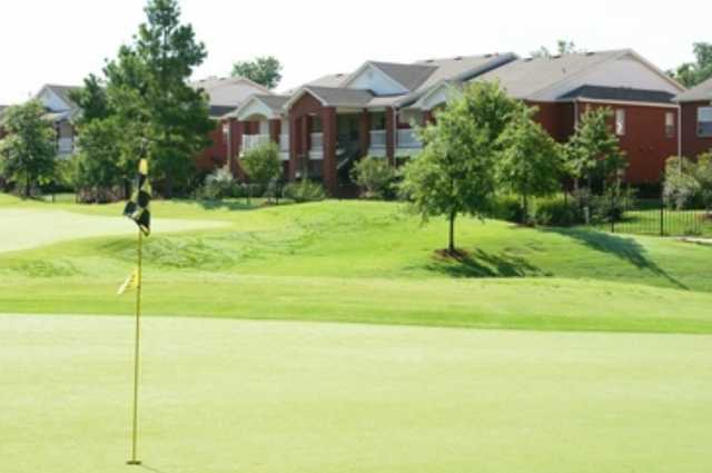 A view of the clubhouse with green in foreground (courtesy of Lindsey Management)