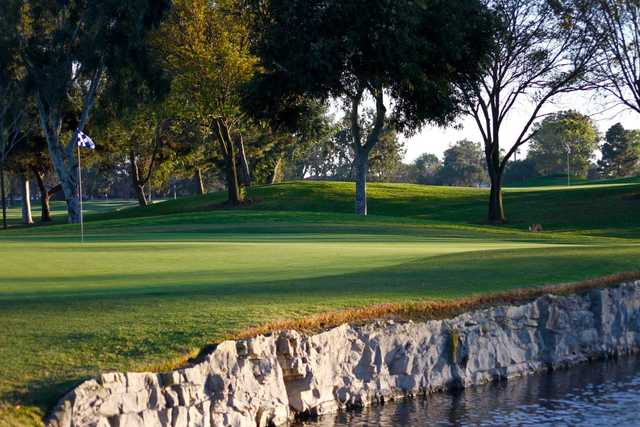 A view of green surrounded by water at Costa Mesa Golf & Country Club.