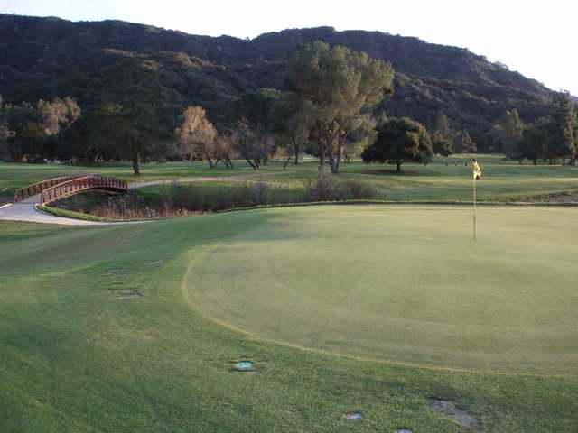 A view of green with bridge on the left side at Soule Park Golf Club