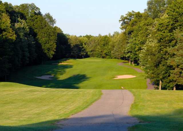A view of green with narrow path on the right at Timber Ridge Golf Course