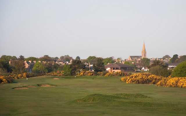 A view of the 5th green from Nairn Dunbar Golf Club with the clubhouse in the background