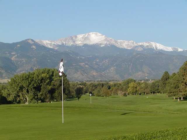 A view of a green with mountains in background from Patty Jewett Golf Club