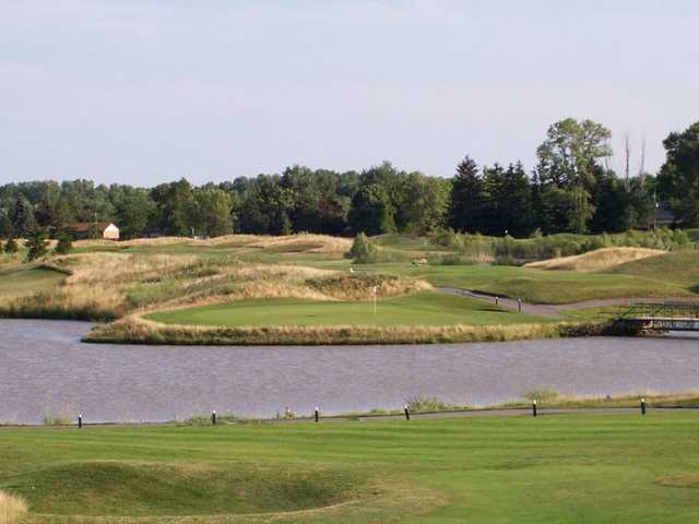 A view of a hole surrounded by water at Sawmill Creek Golf Resort & Spa.
