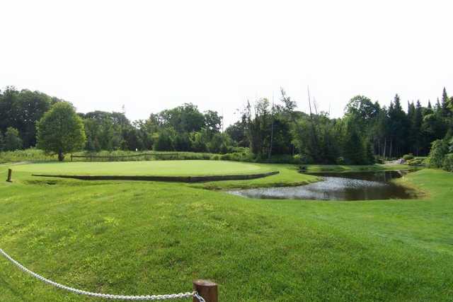 A view of hole #15 surrounded by water at Six Foot Bay Resort Golf Club