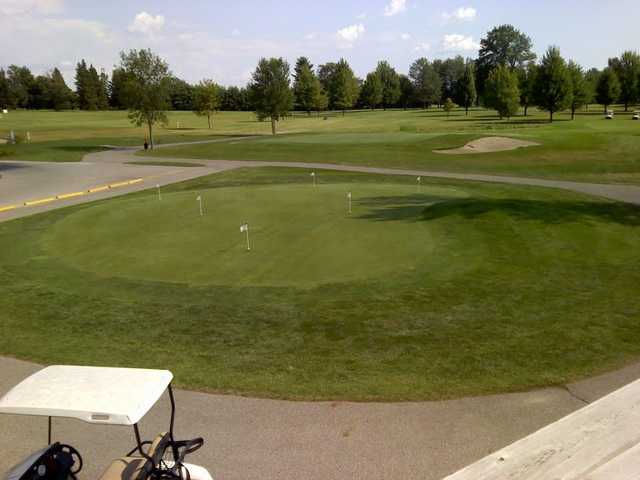 A view from the clubhouse of the putting green at Sandy Ridge Golf Course
