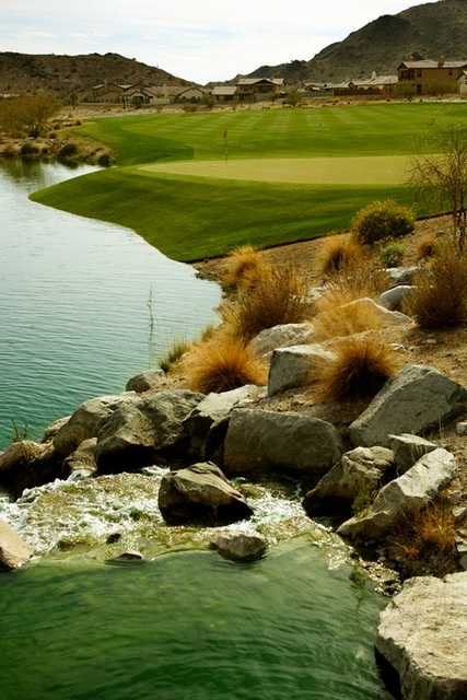 A view of green #9 with water coming into play from left at Founder's Course at Verrado Golf Club.