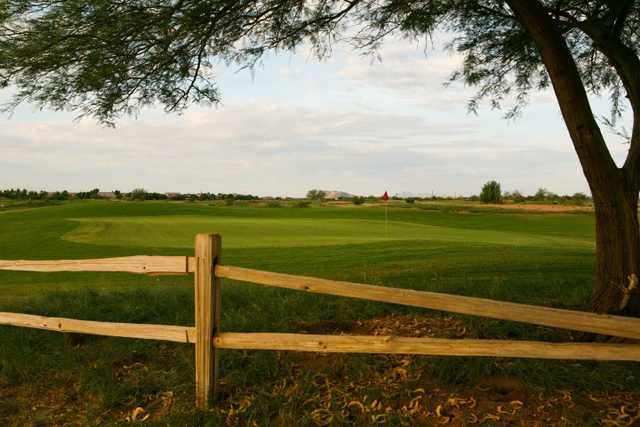 A view over the fence of the 16th green at Bear Course from Bear Creek Golf Complex