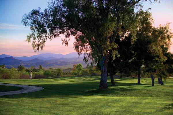 A view from 	Rancho de Los Caballeros Golf Club with mountain in background