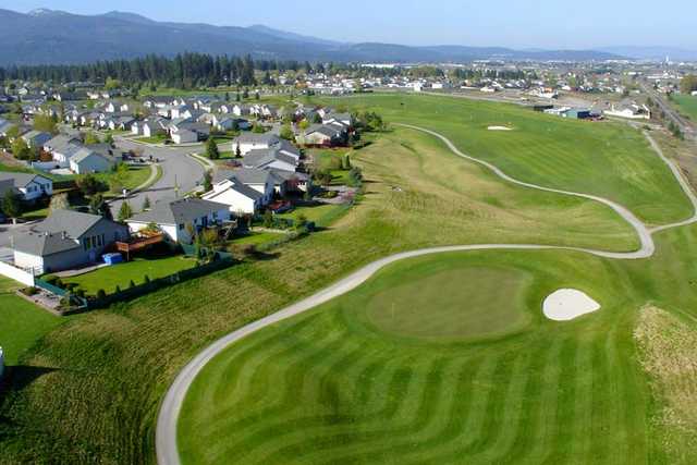 A view of a hole with undulating narrow path on the left side at Prairie Falls Golf Club