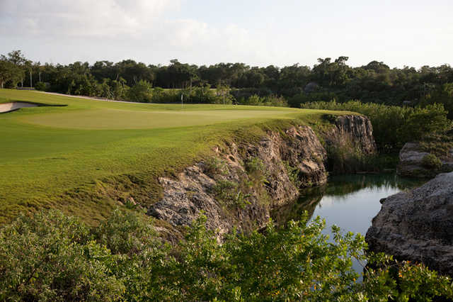 A view of green #10 with waves coming into play at El Camaleon Mayakoba Golf Club