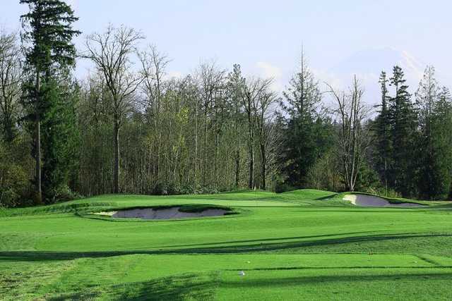 A view of the 6th green guarded by sand traps at Druids Glen Golf Club