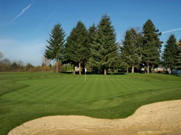 A view of hole #6 guarded by sand trap at Eighteen Hole from Riverbend Golf Complex