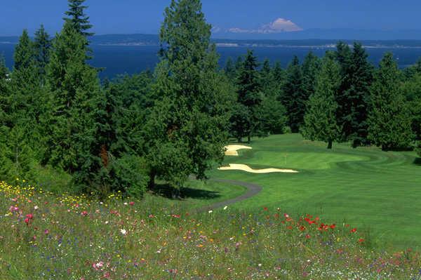 A view of a green guarded by bunkers at Port Ludlow Resort