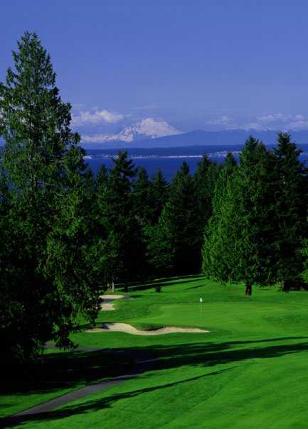 A view of a hole with sand traps on the left at Port Ludlow Resort