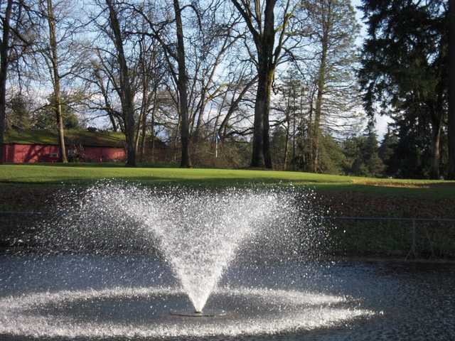 A view of the 15th green with water fountain in foreground at Brookdale Golf Club