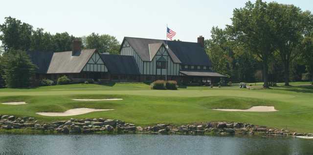 A view of a green and the clubhouse at Tippecanoe Country Club