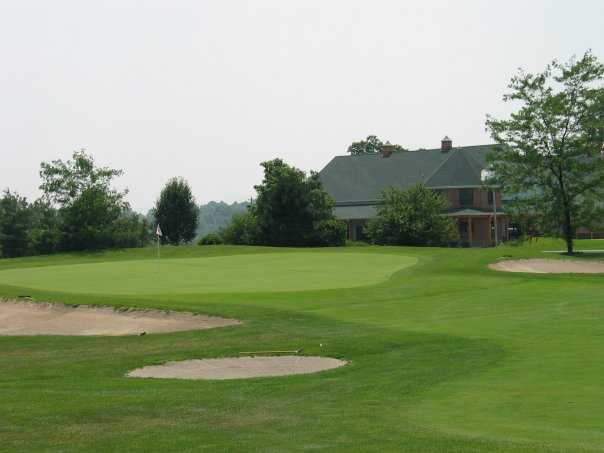A view of green surrounded by sand traps at Deer Creek Golf Club