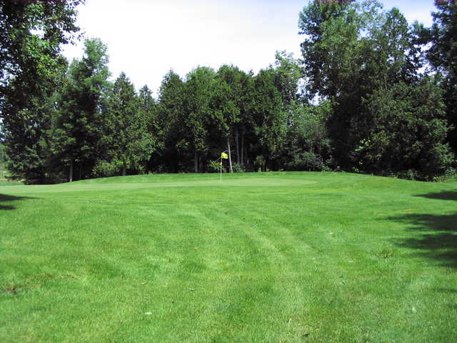 A sunny view of a green at Yellow Course from Irish Hills Golf & Country Club.