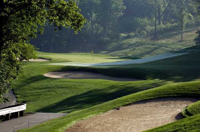 A view of a green guarded by bunkers at The Fort Golf Resort.