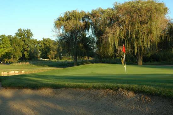 A view of a hole protected by sand trap at Golf Club of Indiana