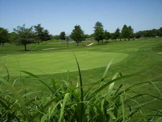 A view of a hole and a fairway at Sahm Golf Course