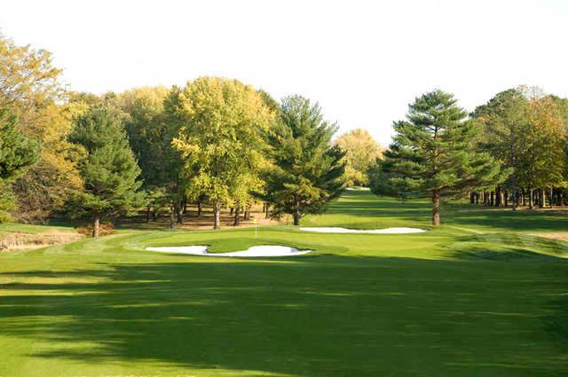 A view of a green protected by sand traps at Garrisons Lake Golf Club