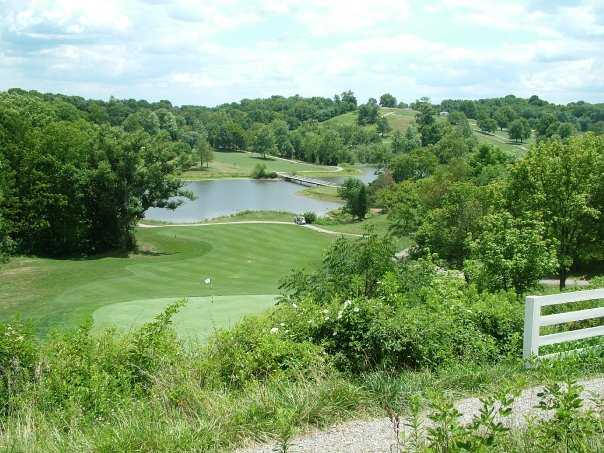 A view of green and fairway with water in background at Hickory Sticks Golf Club