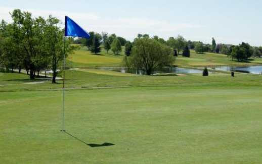 A sunny view of a hole at Lone Oak Golf Course