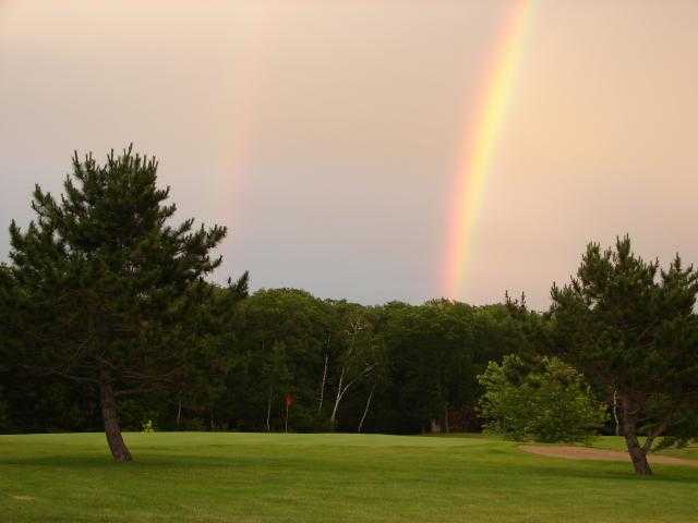 A view of rainbow over the 7th hole at Afton Alps Golf Course