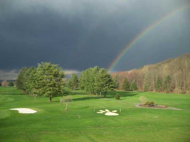 A view of a rainbow over The Lynx at River Bend Golf Club