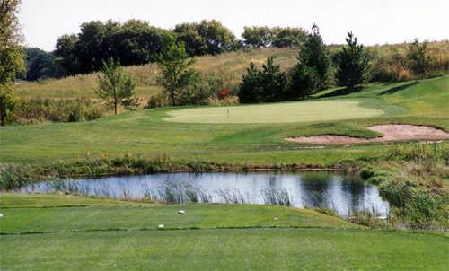 A view of green guarded by bunker at Boulder Pointe Golf Club