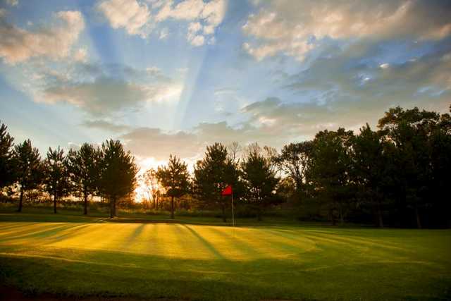A beautiful sunny view of green #14 at Thumper Pond Golf Course