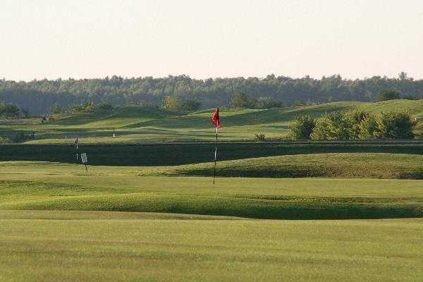 A sunny view of green #4 at Drake Creek Golf Club
